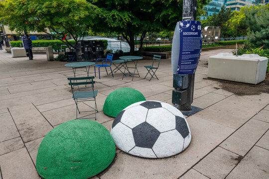 Soccerscape painted boulder soccer ball installation