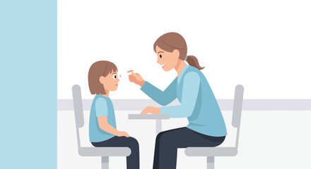 Obraz premium Pediatric eye exam: eye doctor testing child's vision at clinic