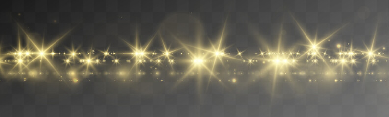 Sparkling golden stars drift with radiant dust particles in motion. Transparent glowing effects create a dreamy visual texture. Elegant glitter details enhance the festive design. © lizaveta