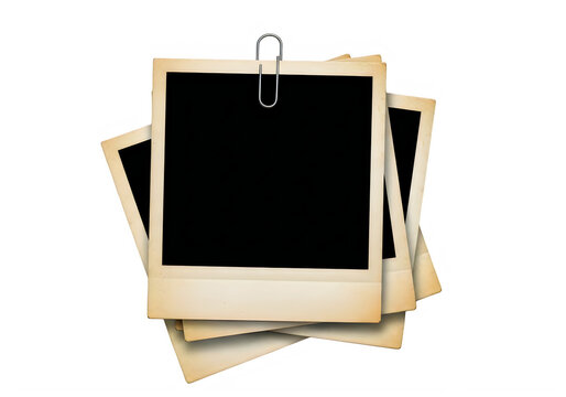 Stack of blank Polaroid photos with paperclip on white background transparent background