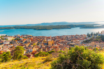 Spectacular sunset panorama of Sibenik old city and the St. Anthony's Channel from the St. John's Fortress (Sveti Ivan), Dalmatia, Croatia. © Zedspider