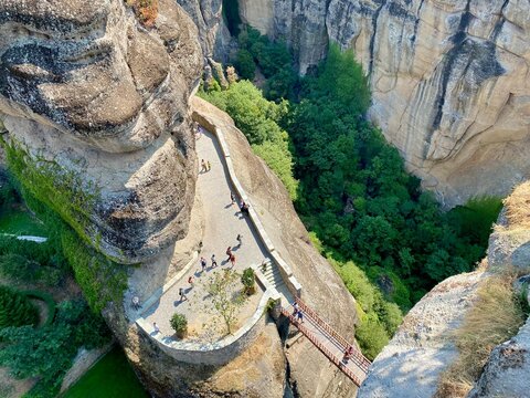 Stone stairs leading to Varlaam Monastery in Meteora, Greece. Dramatic cliffs and ancient monastery perched on towering rock formations