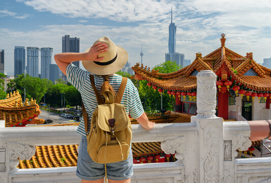 Female tourist is enjoying view of Kuala Lumpur, Malaysia