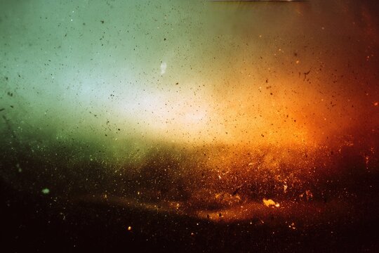 Atmospheric, abstract, textured dust motes suspended in gradient light