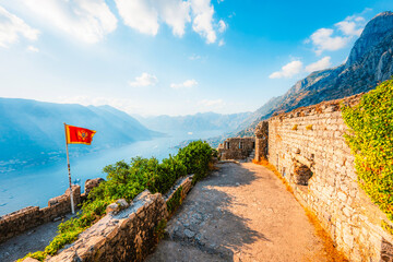 Naklejka premium Kotor Bay and the Old Town Kotor from the ancient San Giovanni fortress walls, featuring the Adriatic sea and majestic mountains, Montenegro.