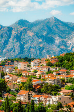 Charming narrow street in the historic old town of Kotor,  ancient stone walls, shutters, and polished limestone pavement, UNESCO site in Montenegro