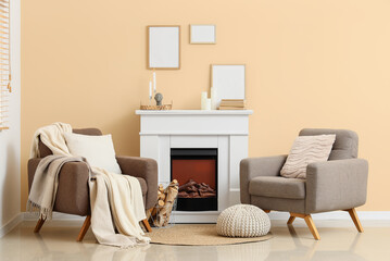 Obraz premium Cozy living room interior with modern fireplace, comfortable armchairs, and minimalist decor for home comfort
