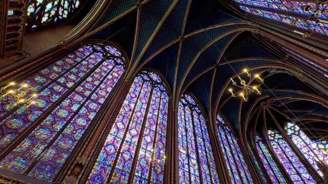 Magnificent interior view of the Sainte Chapelle in Paris, featuring the stunning stained glass windows, a masterpiece of Gothic architecture and a famous historical landmark in France
