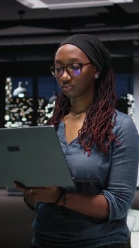 Vertical video showing programmer in office developing complex machine learning algorithms simulating human brain thought processes.