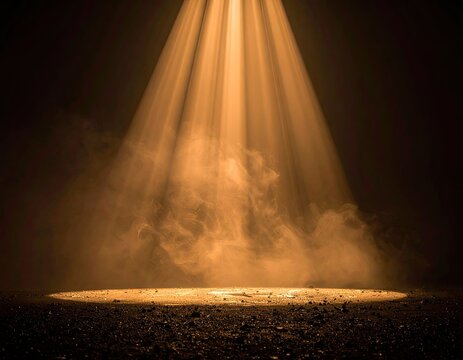 Dramatic illumination; spotlight casting warm light onto a misty, textured surface