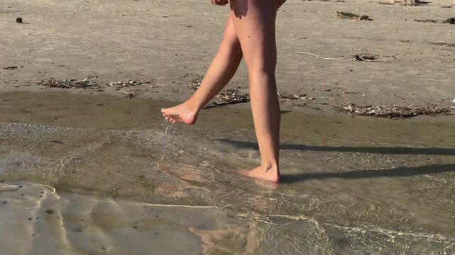 Young Woman in a Swimsuit on a Sandy Beach on Rab Island, Croatia