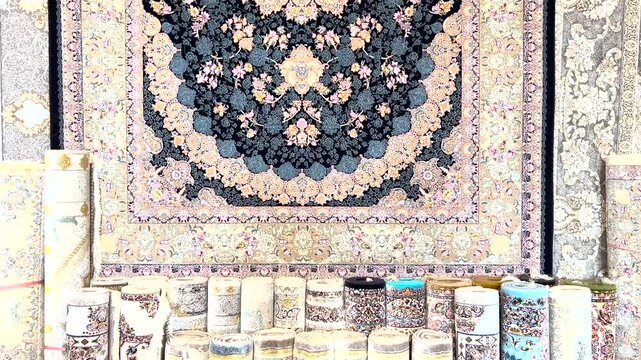 Multiple Persian carpets for sale at the store. Traditional hand-woven rugs with Vibrant colors.