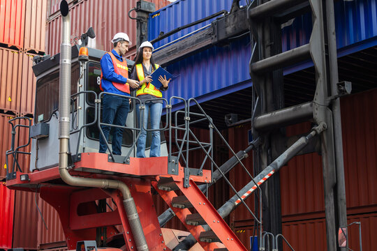 Logistics supervisors inspecting cargo operations at container terminal, Workers using reach stacker crane for shipping container management, Logistics team working at container logistics port