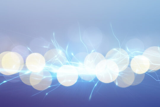 Abstract background of light blue shades with glare and bokeh effect.