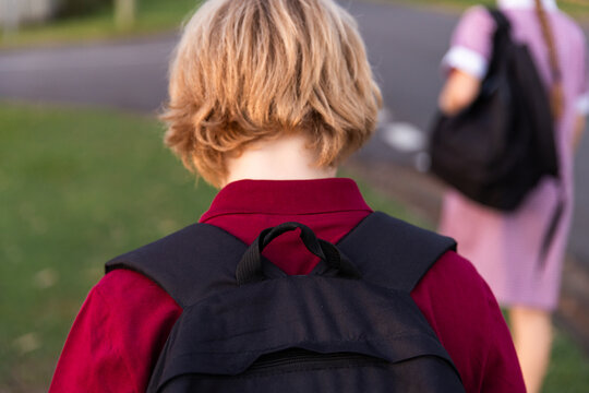 children walking home after school with backpacks