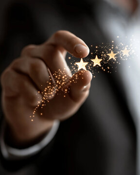 Customer Feedback Stars: A person's hand delicately touches a trail of glittering gold stars, symbolizing excellent customer feedback and a high rating.