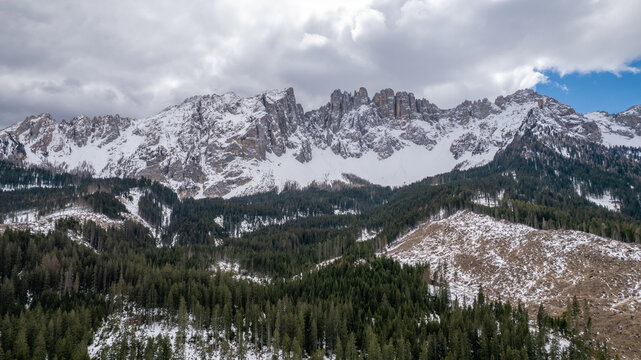 Aerial View Latemar Mountain Range Viewed from Lake Carezza under Cloudy Sky, Dolomites, South Tyrol, Italy