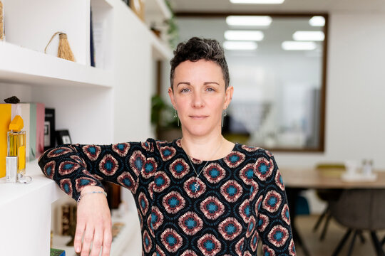 Confident professional woman posing in her office