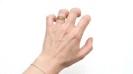 Obraz premium Close-up of a graceful female hand adorned with a golden ring and bracelet, fingers gently curved, poised for a subtle gesture or reach