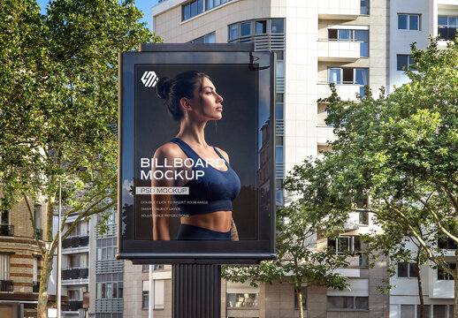 Vertical Billboard Mockup in Bright City Street for Outdoor Advertising Campaigns