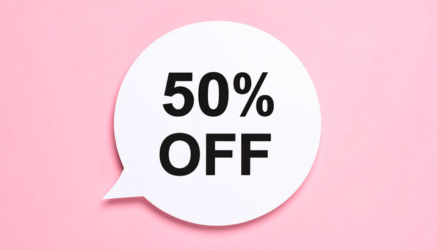 White circular speech bubble with 50 percent OFF text in bold modern typography, pink background, promotional discount, modern retail marketing. Close-up.