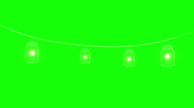 Mason jar string lights hang horizontally in a glowing line against a vibrant green screen background for easy chroma key editing.