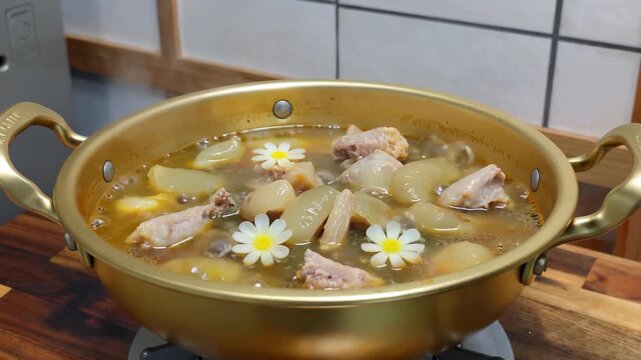 Stew chicken and radish soup in a pot to nourish and nourish the health