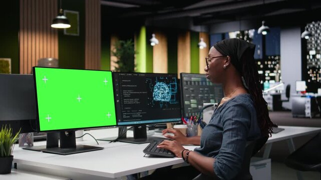 Green screen mockup PC used by tech agency admin using AI to optimize software in office late at night with debugging and troubleshooting context.