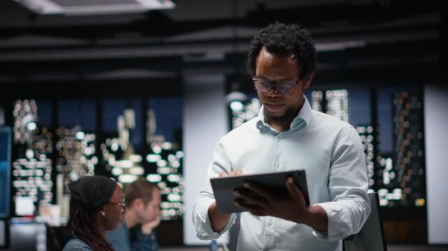 IT expert using tablet in office, working with AI programming languages. Programmer using a device in workplace to do AI tech quality assurance.