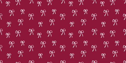 Naklejka premium Seamless pattern with pink ribbon bows on a dark pink background