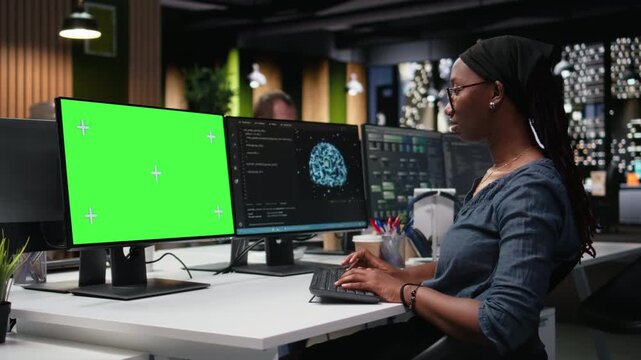 Green screen mockup computer used by programmer typing code, developing machine learning models to automate tasks. Developer writing programming language scripts on chroma key PC for coding workflows.