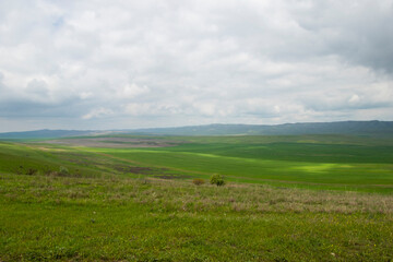 Fototapeta premium Dramatic badland formations and rugged canyons dominate the landscape of Vashlovani Protected Areas in eastern Georgia.