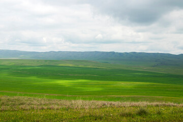Fototapeta premium Dramatic badland formations and rugged canyons dominate the landscape of Vashlovani Protected Areas in eastern Georgia.
