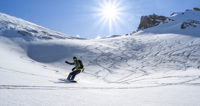 Snowboarder with splitboard rides in the snow, ski tour Geierspitze, Wattentaler Lizum, Tuxer Alps, Tyrol, Austria