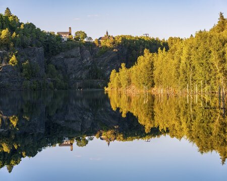 The slate lake in the Kie&szlig;lichbruch in the evening light, former slate quarry, birch forest on the shore, Technical monument of the historic slate mining Lehesten, Thuringia, Germany