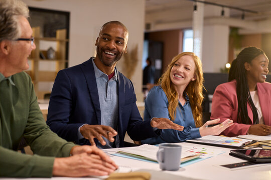 Happy african american businessman talking in meeting