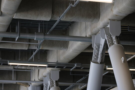 Industrial steel structure beams and seismic braces in a building interior.