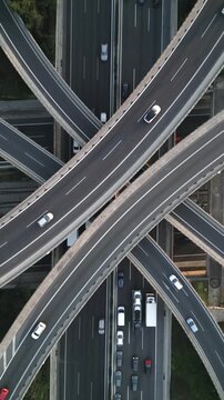 Vertical Aerial View of Highway Interchange and Traffic at Dusk