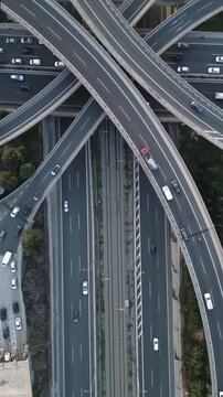 Vertical Aerial View of Highway Interchange and Traffic at Dusk