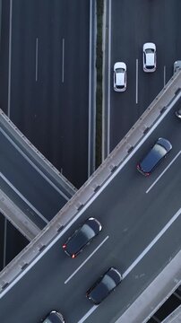 Vertical Aerial View of Highway Interchange and Traffic at Dusk