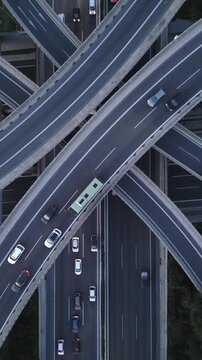 Vertical Aerial View of Highway Interchange and Traffic at Dusk