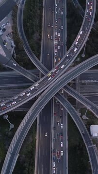 Vertical Aerial View of Highway Interchange and Traffic at Dusk