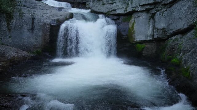 Majestic Gveleti big waterfall cascading down rugged mountain cliffs