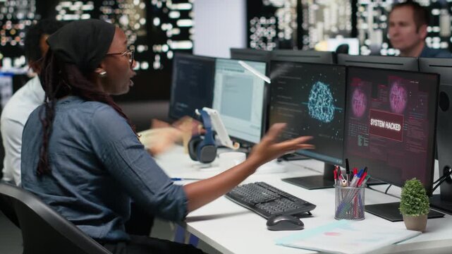 Programmer in office panicked by ddos attack from hacker, trying to protect servers from malware. Scared startup worker frightened by virus sent by cybercriminal bugging company systems.