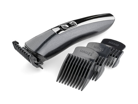 Hair trimmer isolated on white background. Machine for cutting beard and hair. Woman's hand holding the hair trimmer.