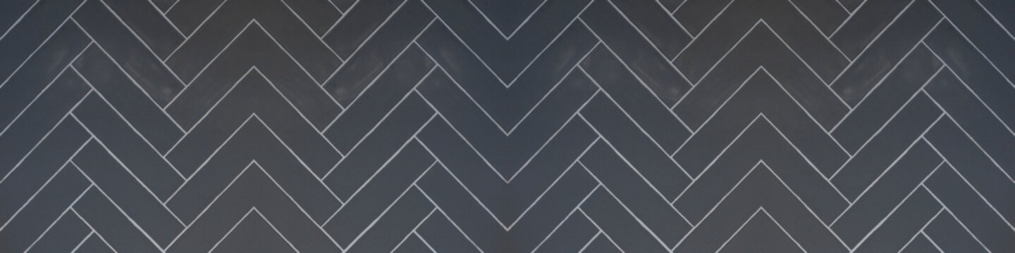 Tile background - Dark gray grey anthracite abstract grunge herringbone tiles texture banner panorama long, seamless pattern