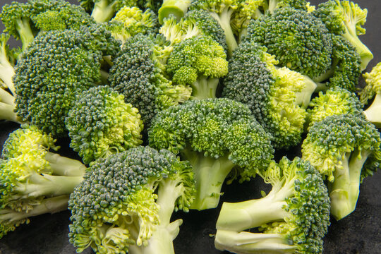 Fresh raw broccoli as background, top view