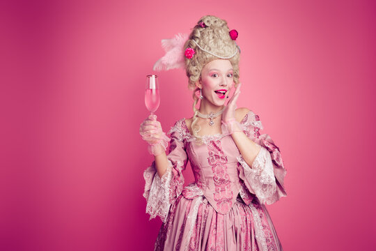 Photo of charming excited marie antoinette wear rich dress drinking wine empty space isolated pink color background