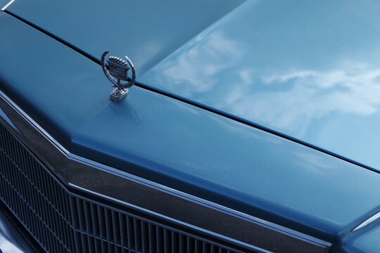 Blue cadillac eldorado grill and sign. Old classic car details.