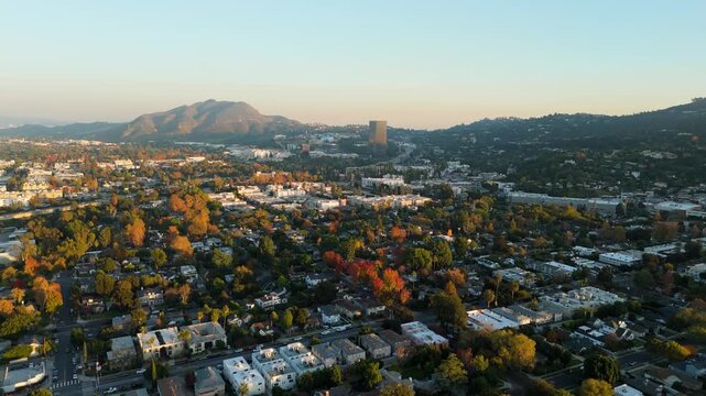 Aerial Drone Flight Over Residential Neighborhoods and Mountains in Los Angeles California at Golden Hour